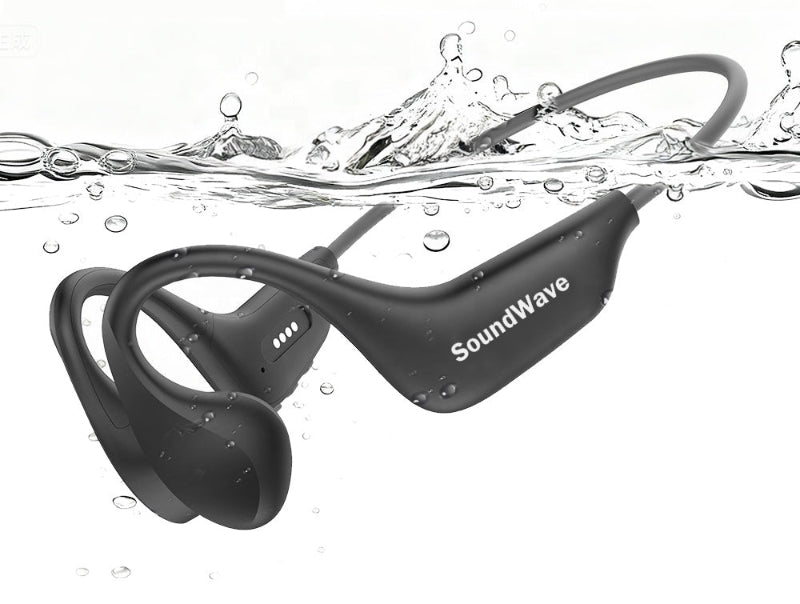 Black SoundWave sport earplugs floating underwater with water splashes and bubbles around them, on a white background.